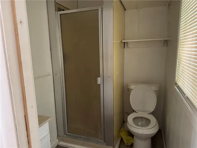 a bathroom with a toilet and a sink