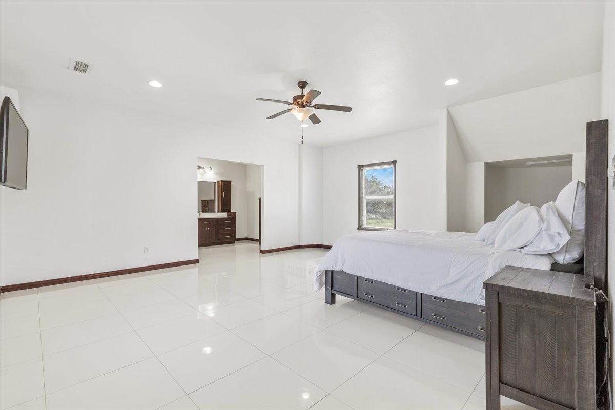 1206 Walter Hoffman Road Cedar Creek, TX 78612 - Photo 15 of 40 Primary Bedroom with en suite bathroom