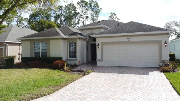 a front view of house with yard outdoor seating and barbeque oven