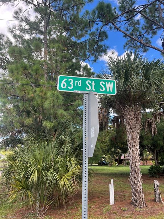 63rd Street Southwest Naples, FL 34105 - Photo 8 of 10 a view of a street with a tree