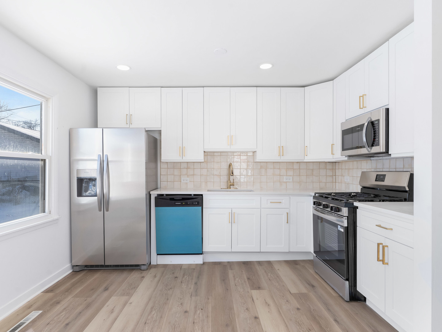 1917 Linden Avenue Hanover Park, IL 60133 - Photo 12 of 22 a kitchen with granite countertop white cabinets and stainless steel appliances