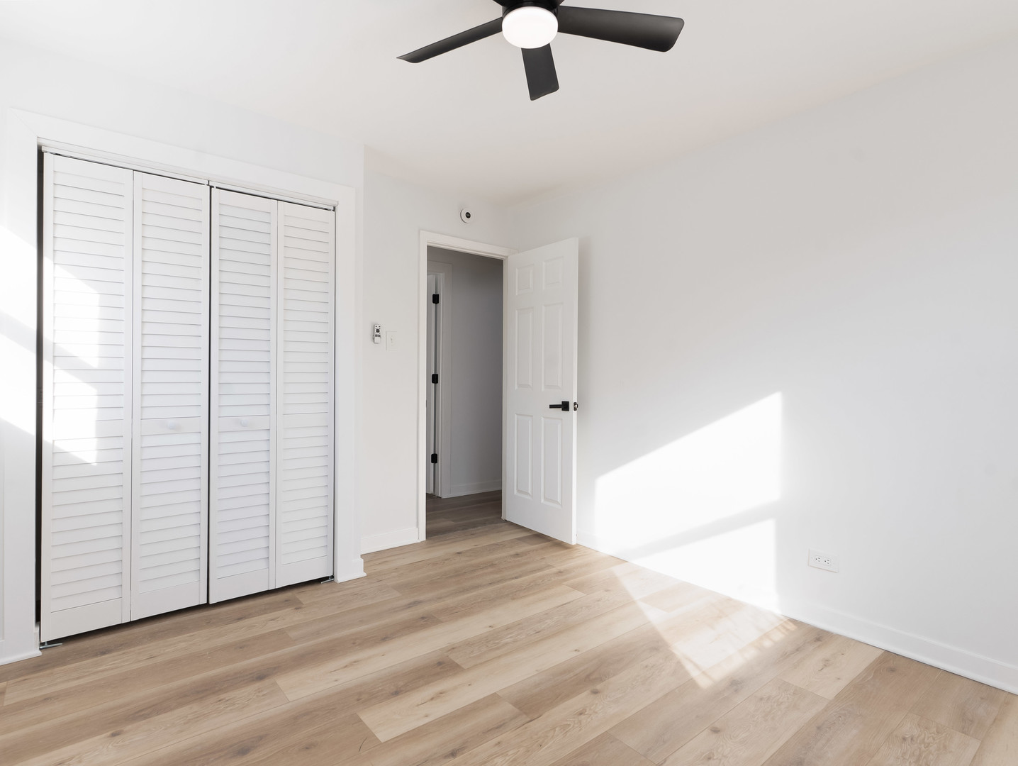 1917 Linden Avenue Hanover Park, IL 60133 - Photo 15 of 22 a view of an empty room with wooden floor