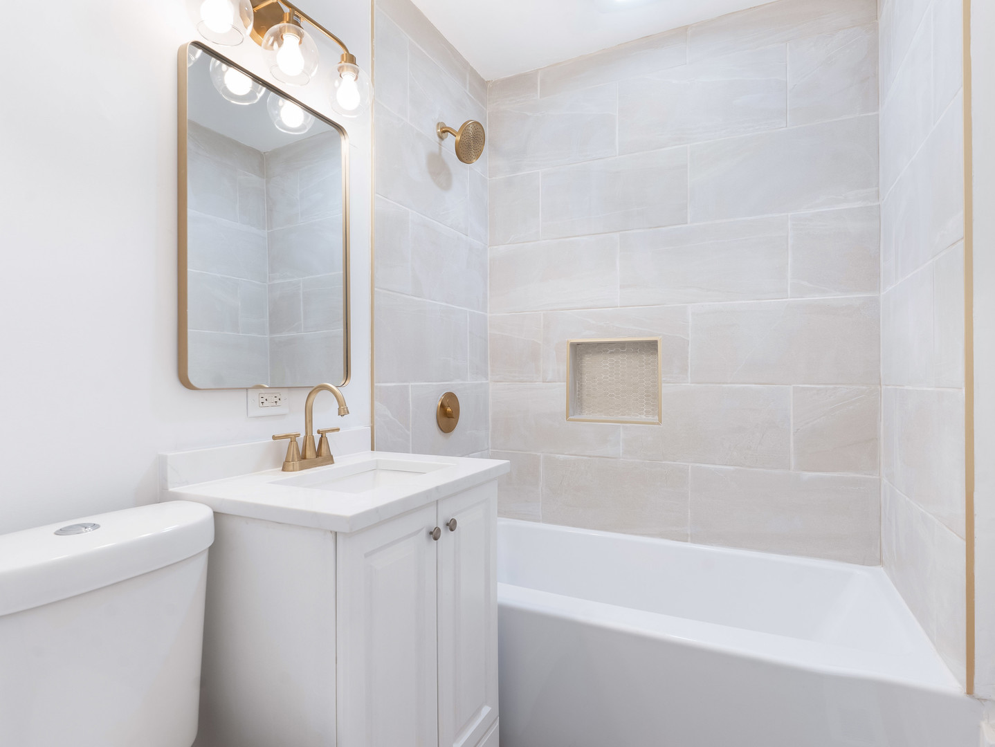1917 Linden Avenue Hanover Park, IL 60133 - Photo 20 of 22 a bathroom with a sink toilet and bathtub