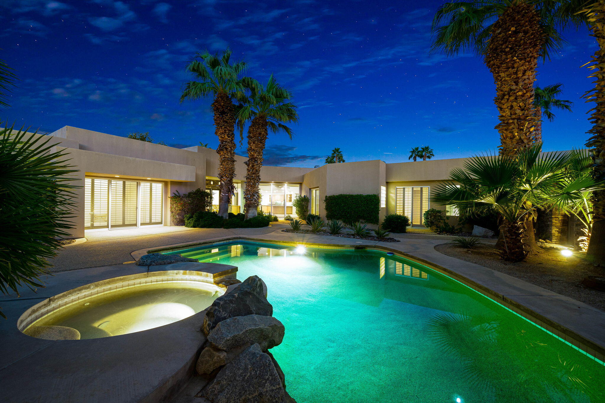 a swimming pool with outdoor seating yard and patio