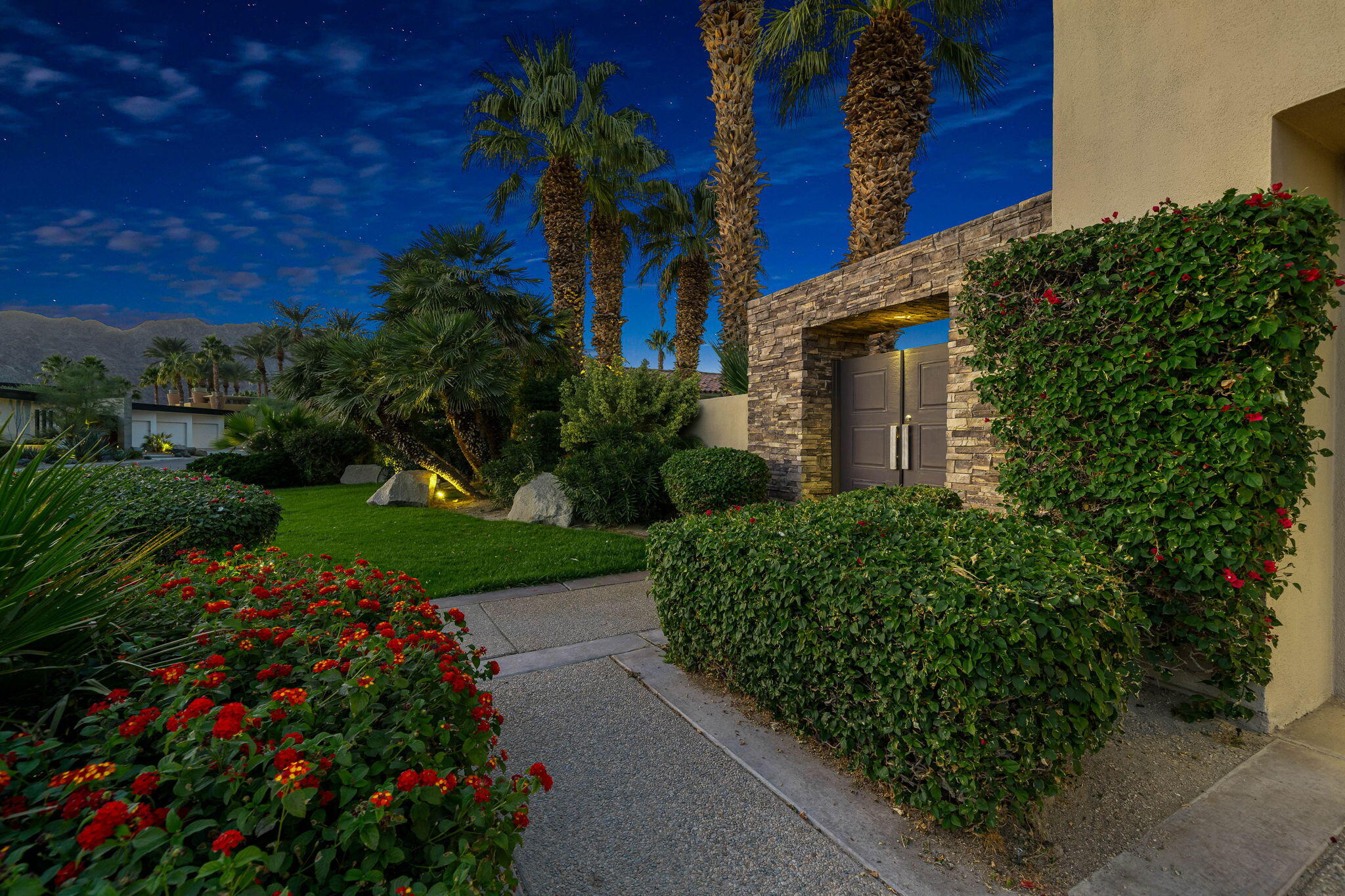 55770 Cherry Hills Drive La Quinta, CA 92253 - Photo 12 of 43 a view of a house with a yard and garden