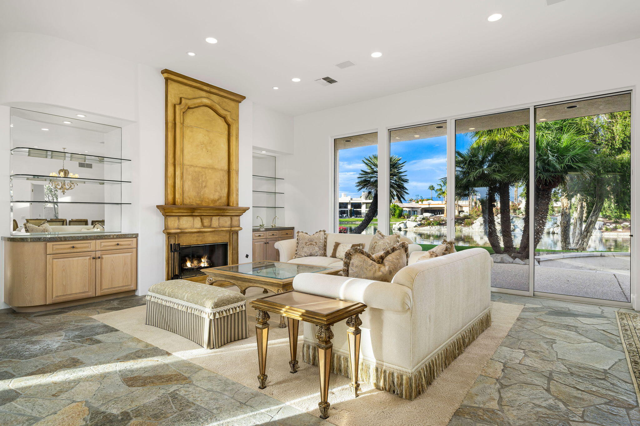 55770 Cherry Hills Drive La Quinta, CA 92253 - Photo 19 of 43 a living room with fireplace furniture and a large window