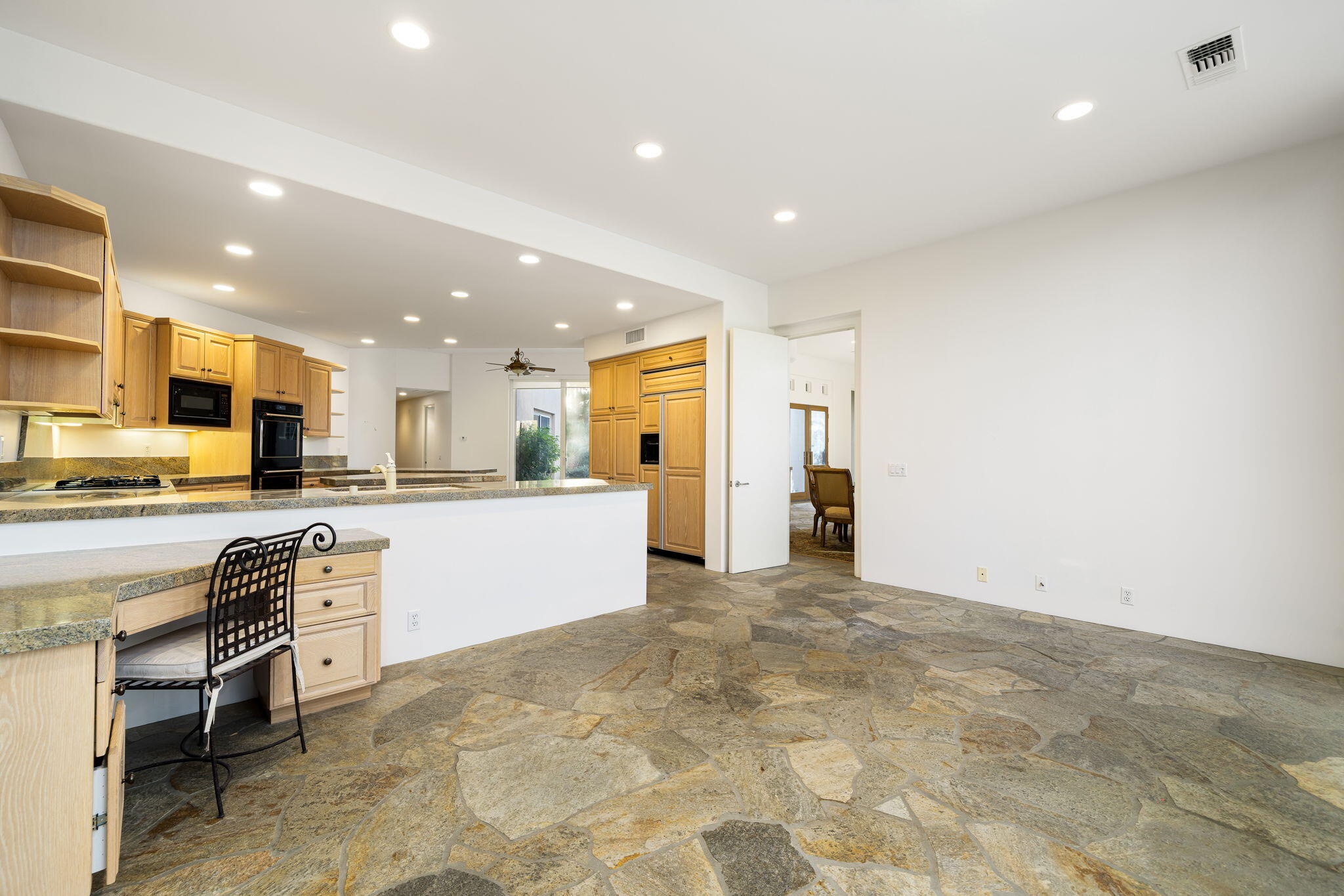 55770 Cherry Hills Drive La Quinta, CA 92253 - Photo 30 of 43 a view of kitchen with stainless steel appliances refrigerator stove microwave and cabinets