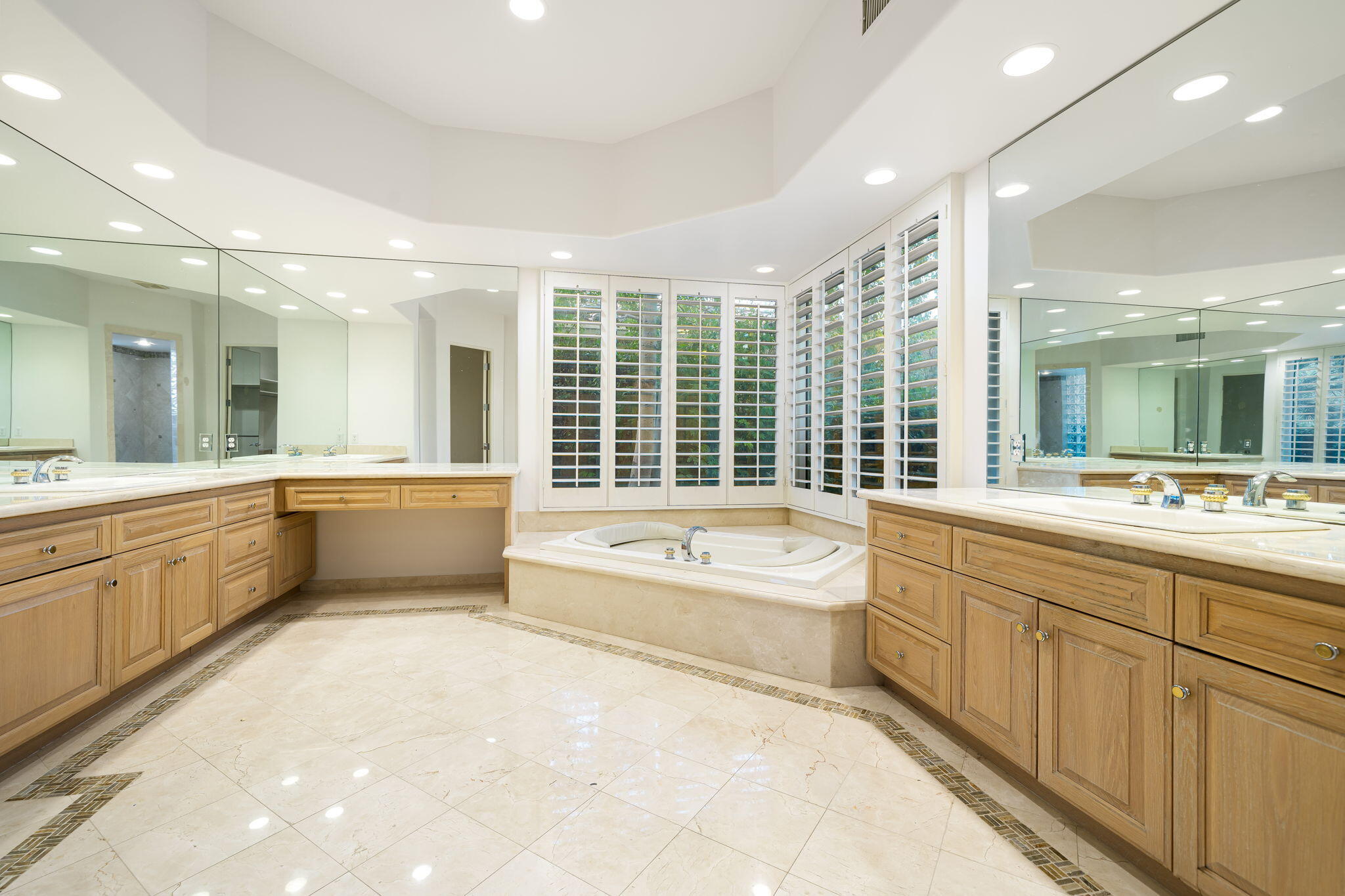 55770 Cherry Hills Drive La Quinta, CA 92253 - Photo 33 of 43 a bathroom with a large tub sink shower and mirror
