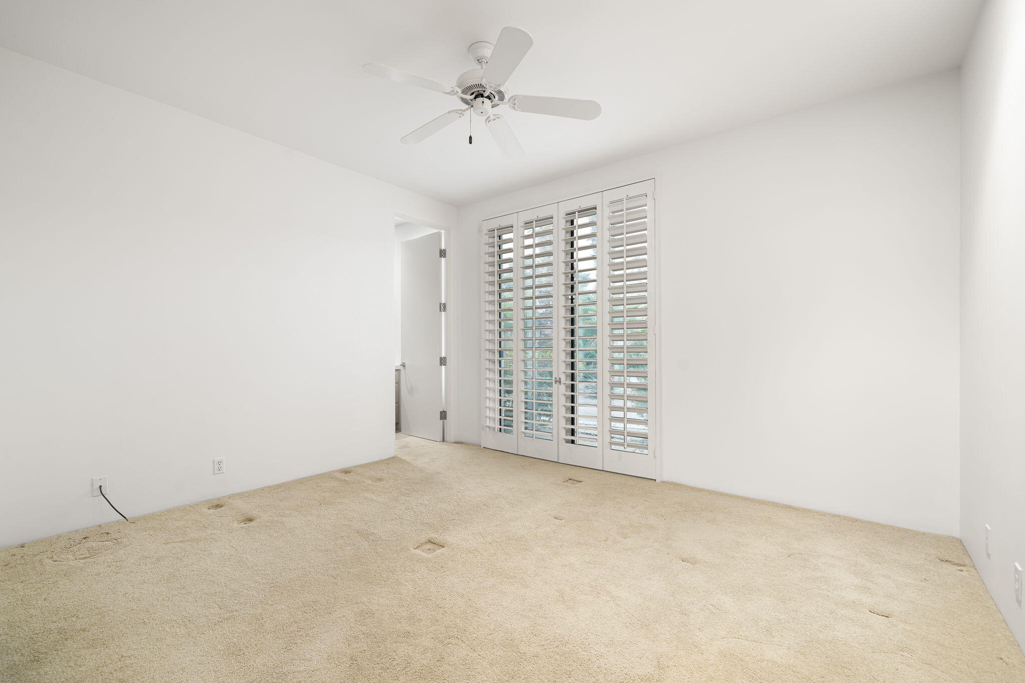 55770 Cherry Hills Drive La Quinta, CA 92253 - Photo 40 of 43 an empty room with windows