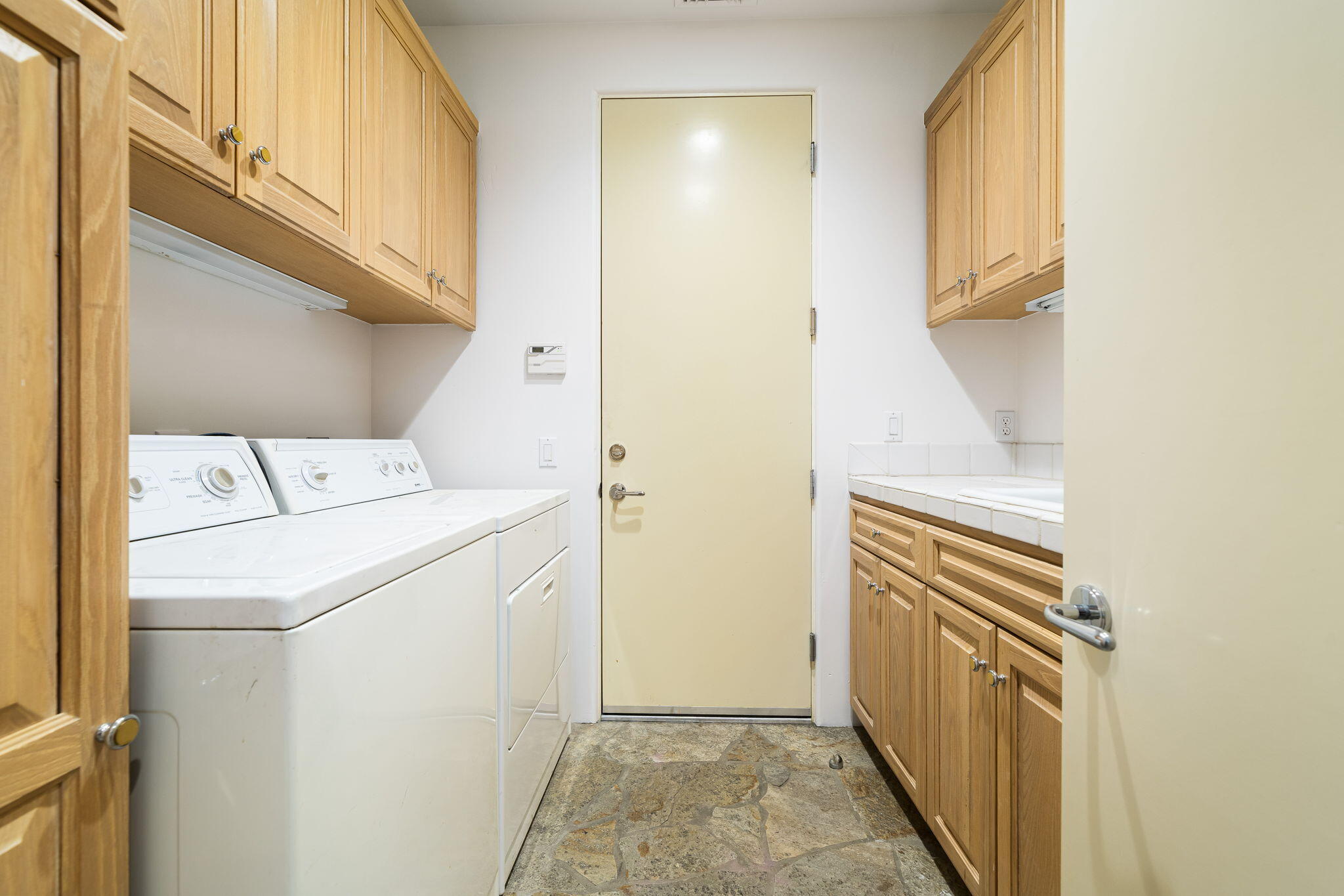 55770 Cherry Hills Drive La Quinta, CA 92253 - Photo 43 of 43 a utility room with dryer and washer
