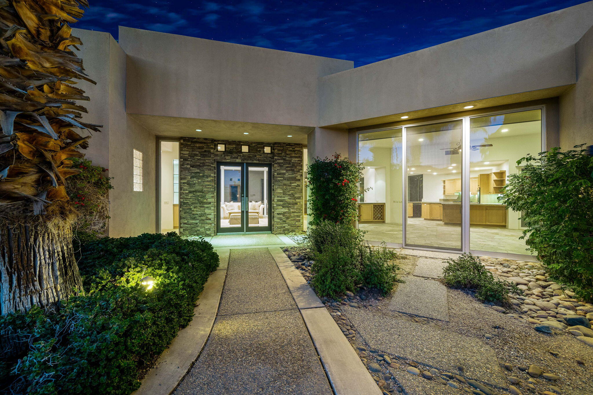 55770 Cherry Hills Drive La Quinta, CA 92253 - Photo 10 of 43 a front view of a house with a yard