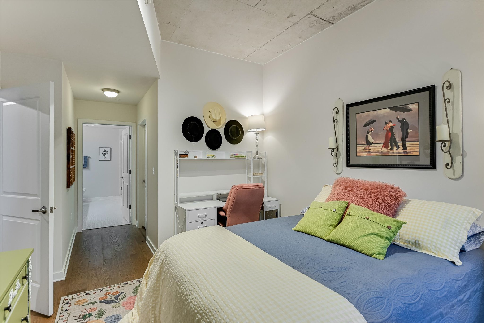 360 Nueces Street, Unit 1405 Austin, TX 78701 - Photo 19 of 40 a bedroom with a bed and furniture