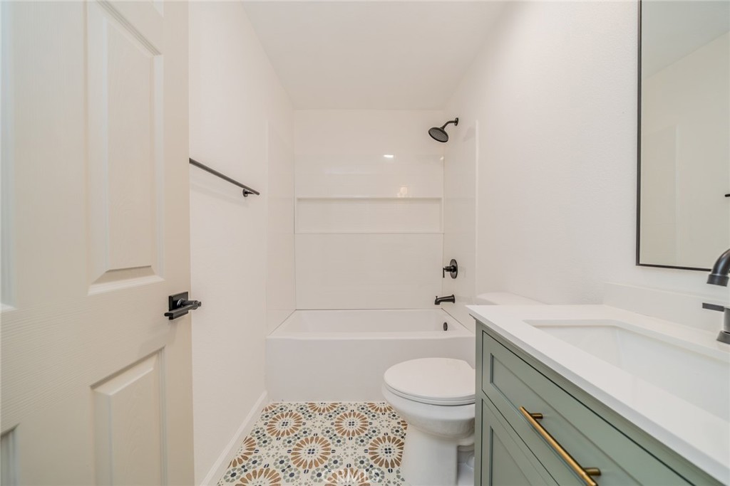 555 North Chestnut Avenue Rialto, CA 92376 - Photo 20 of 33 a bathroom with a sink a toilet and shower