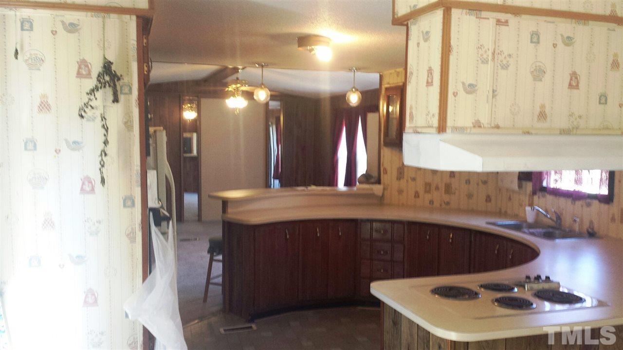 388 Saplin Branch Road Timberlake, NC 27583 - Photo 2 of 12 a bathroom with a sink and a mirror