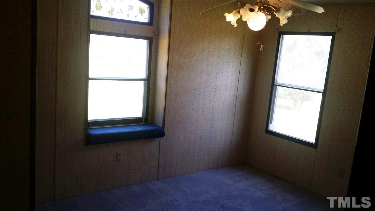 388 Saplin Branch Road Timberlake, NC 27583 - Photo 5 of 12 a view of an empty room with a window