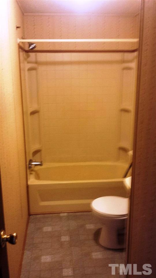 388 Saplin Branch Road Timberlake, NC 27583 - Photo 7 of 12 a bathroom with a toilet and a shower