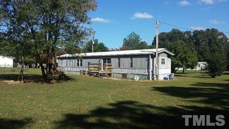 388 Saplin Branch Road Timberlake, NC 27583 - Photo 10 of 12 a view of a house with a big yard