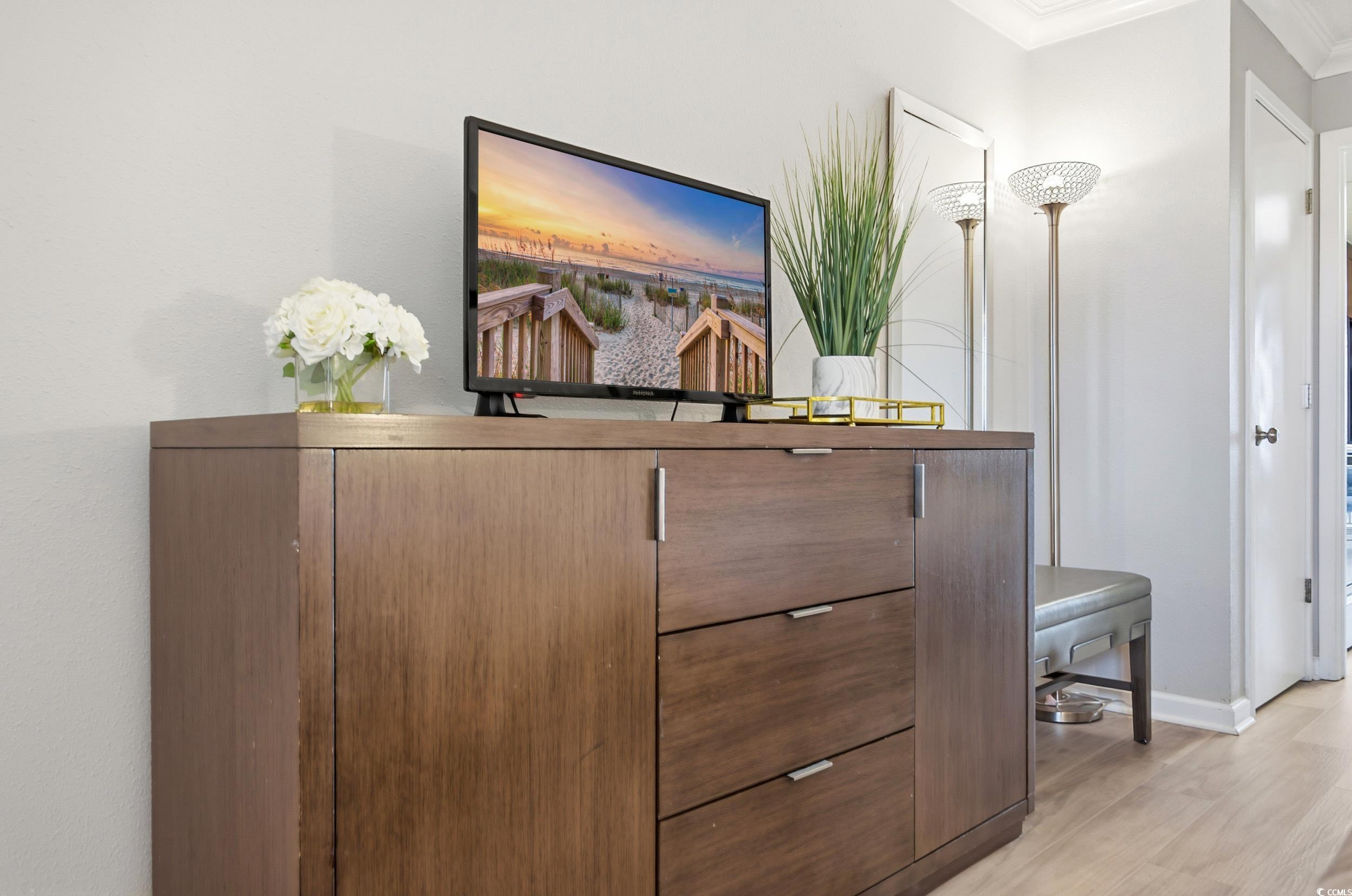 1105 South Ocean Boulevard, Unit 932 Myrtle Beach, SC 29577 - Photo 11 of 32 Detailed view of wood finished floors and crown molding