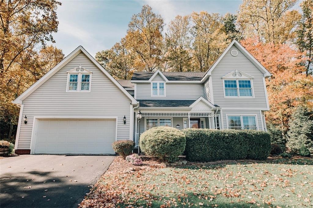 346 Forest Ridge Road Indiana, PA 15701 - Photo 1 of 25 a front view of a house with yard and trees
