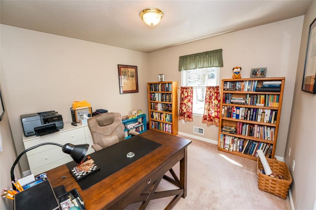 346 Forest Ridge Road Indiana, PA 15701 - Photo 16 of 25 a living room with furniture and a book shelf