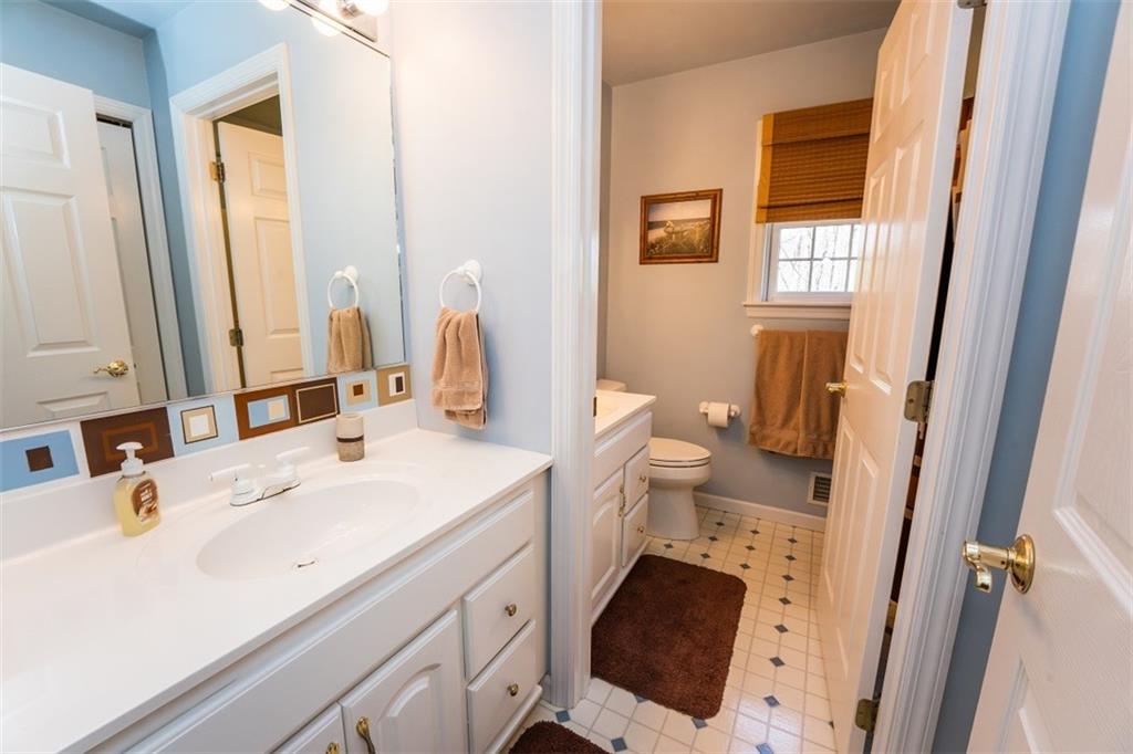 346 Forest Ridge Road Indiana, PA 15701 - Photo 17 of 25 a bathroom with a sink a toilet and a mirror