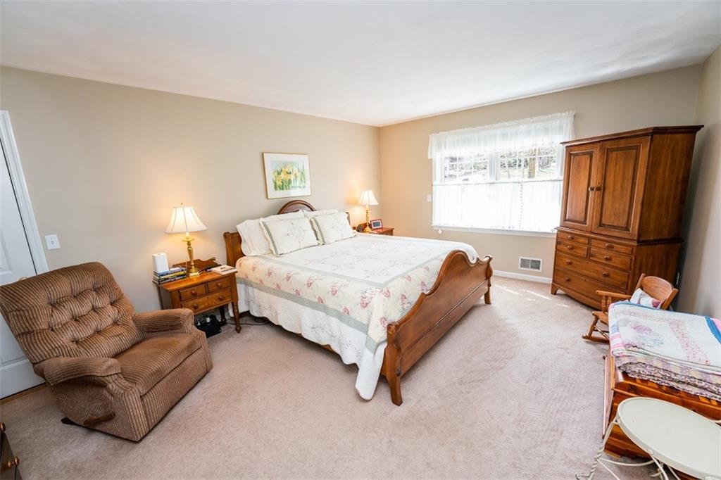 346 Forest Ridge Road Indiana, PA 15701 - Photo 18 of 25 a bedroom with a bed couch and a window