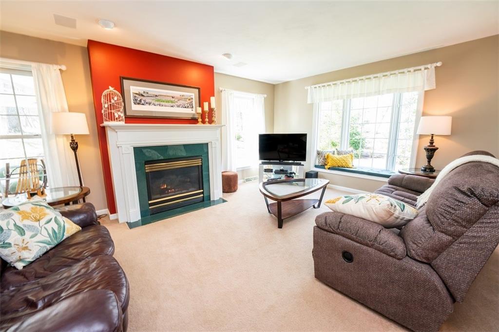 346 Forest Ridge Road Indiana, PA 15701 - Photo 9 of 25 a living room with furniture a fireplace and a flat screen tv