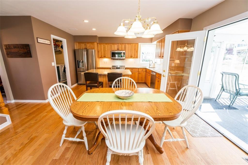 346 Forest Ridge Road Indiana, PA 15701 - Photo 10 of 25 a dining room with furniture a chandelier and wooden floor