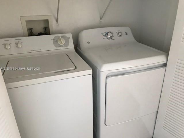 6984 Southwest 39th Street, Unit H202 Davie, FL 33314 - Photo 2 of 17 a utility room with dryer and washer