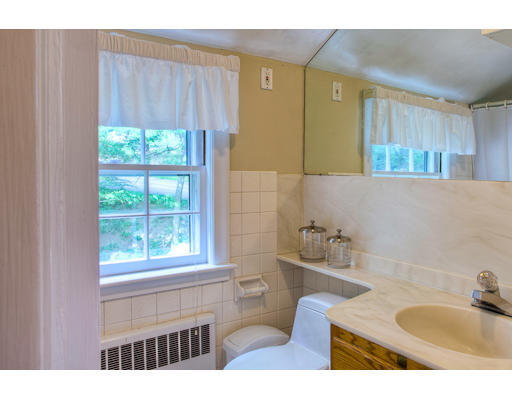 7 Lockeland Road Winchester, MA 01890 - Photo 12 of 19 a bathroom with a sink a toilet and a window