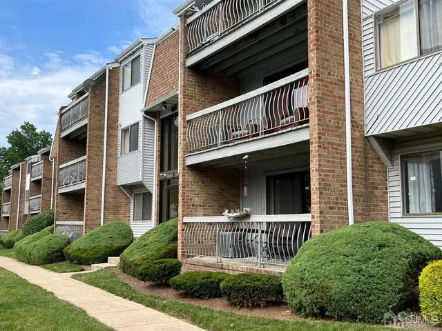 a front view of a house with garage and porch