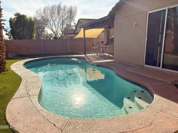 a view of a swimming pool with a sitting space