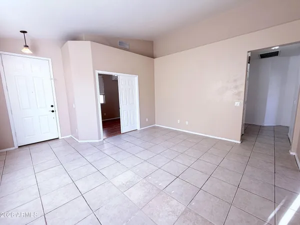 a view of a utility room with cabinets