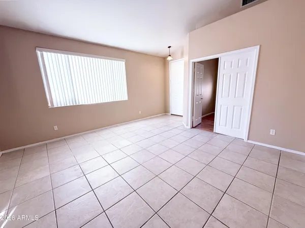 a view of an empty room and window