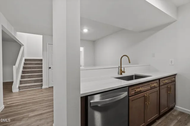 a kitchen with stainless steel appliances a stove a microwave and cabinets