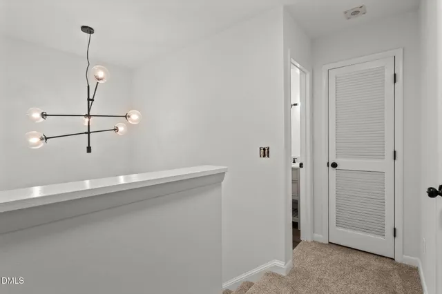 a view of an empty room with sliding door