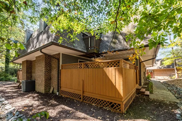 a view of a house with a tree