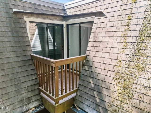 an aerial view of a house with a garden