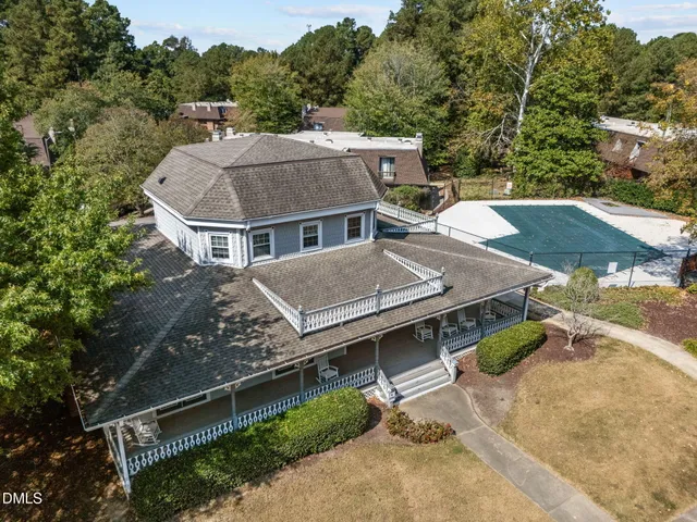 a view of a backyard with sitting area