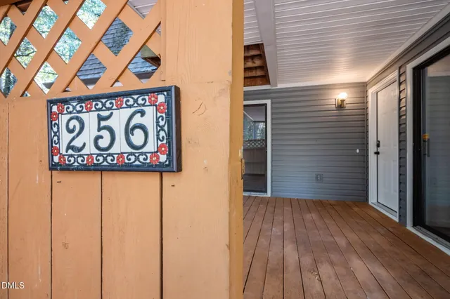 a view of outdoor space with wooden floor and stairs