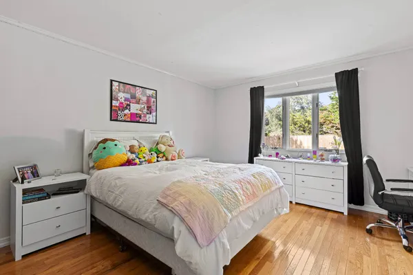 a bedroom with a bed and a window in it