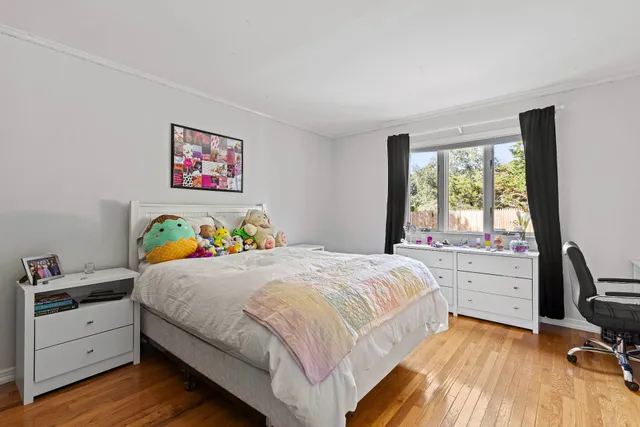 a bedroom with a bed and a window in it