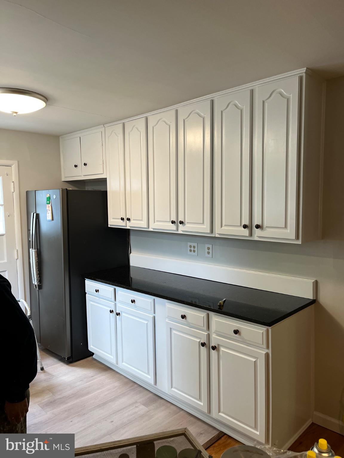 3709 Ralph Road Silver Spring, MD 20906 - Photo 5 of 20 a kitchen with granite countertop white cabinets and stainless steel appliances