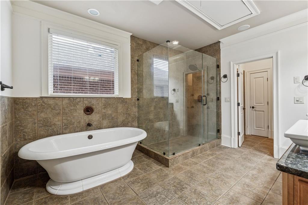1220 State Street Northwest Atlanta, GA 30318 - Photo 18 of 40 a bathroom with a sink a toilet and shower