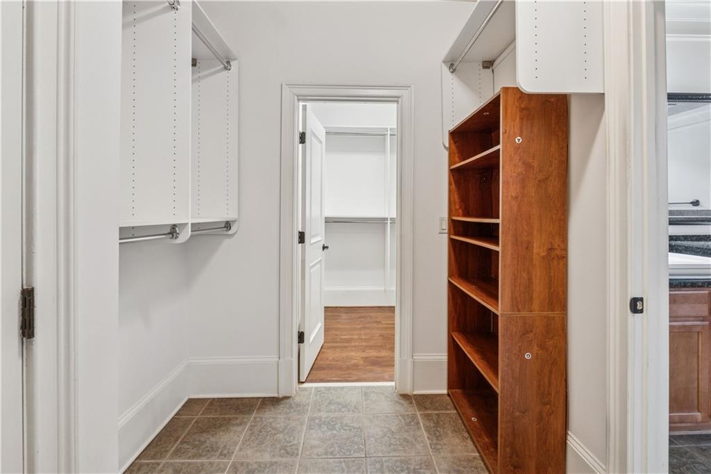 1220 State Street Northwest Atlanta, GA 30318 - Photo 21 of 40 a view of walk in closet with empty racks