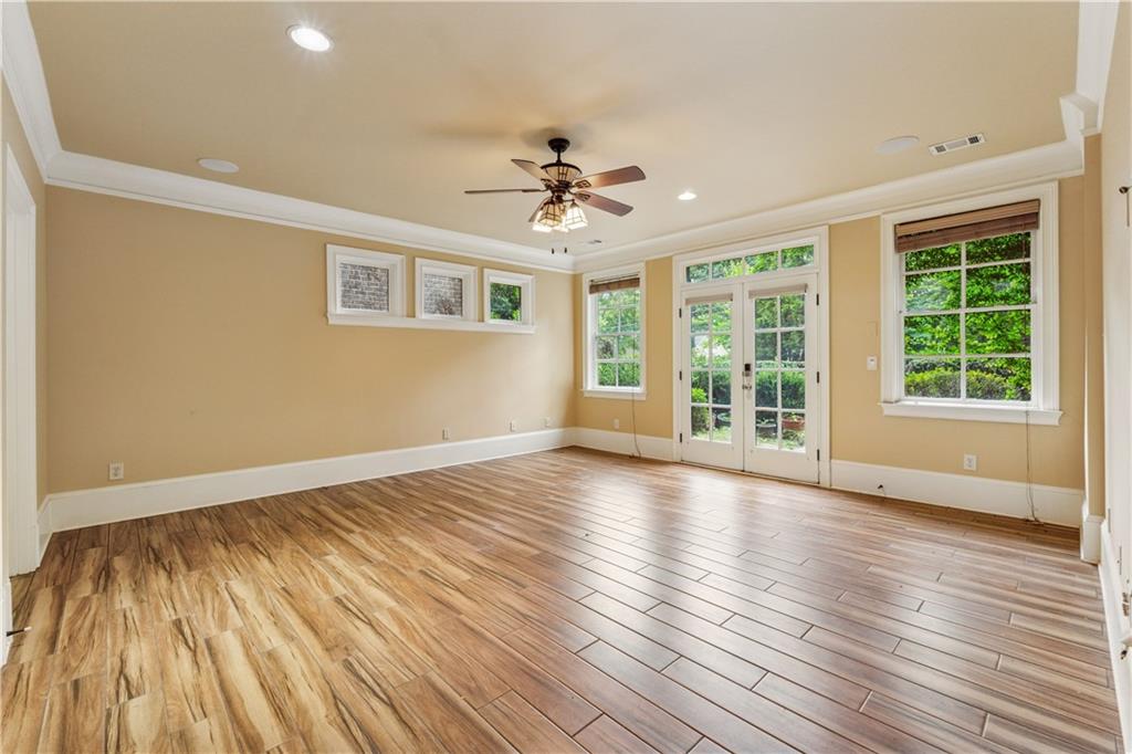 1220 State Street Northwest Atlanta, GA 30318 - Photo 25 of 40 a view of an empty room with wooden floor and a window