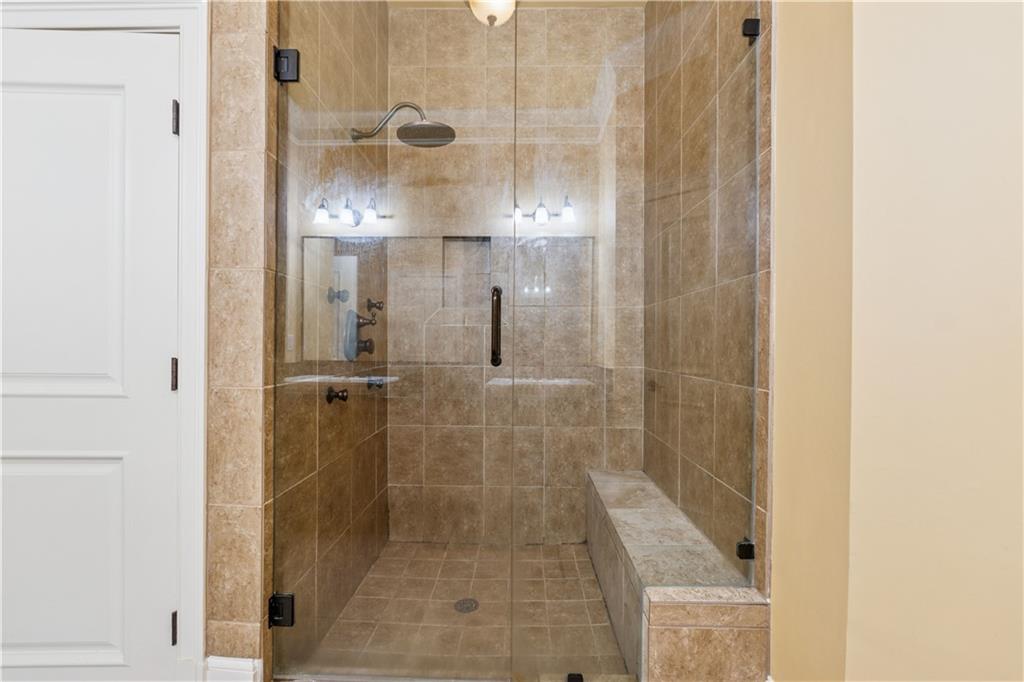 1220 State Street Northwest Atlanta, GA 30318 - Photo 28 of 40 a bathroom with a glass shower door