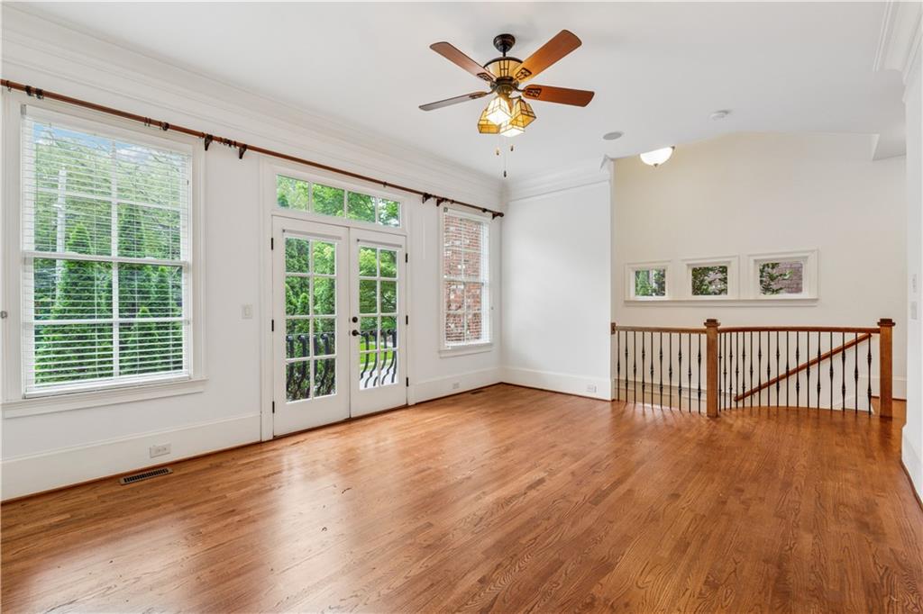 1220 State Street Northwest Atlanta, GA 30318 - Photo 4 of 40 a view of an empty room with a window and wooden floor