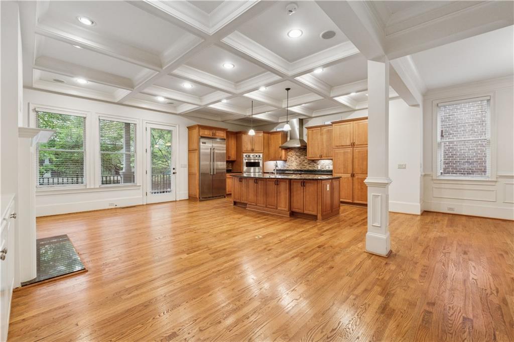 1220 State Street Northwest Atlanta, GA 30318 - Photo 6 of 40 a view of a kitchen with a stove cabinets and wooden floor