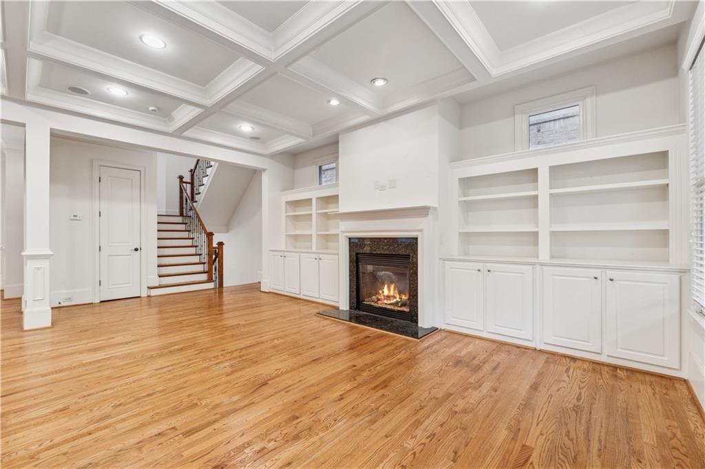 1220 State Street Northwest Atlanta, GA 30318 - Photo 7 of 40 a view of an empty room with a fireplace and a window